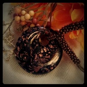 Glass disk pendant with cord chain